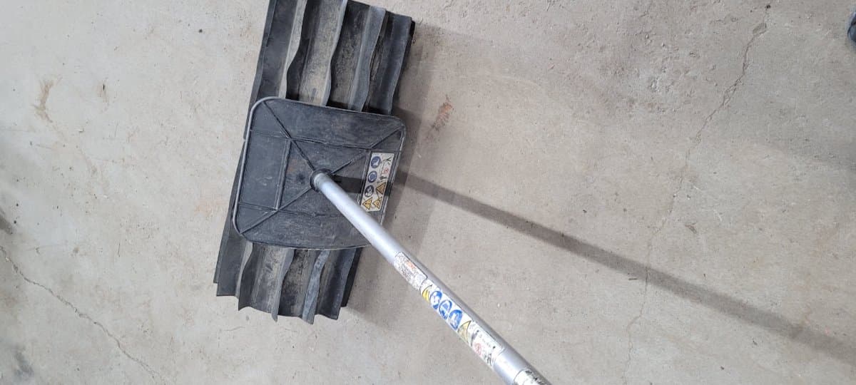 Sweeper attachment for trimmer base